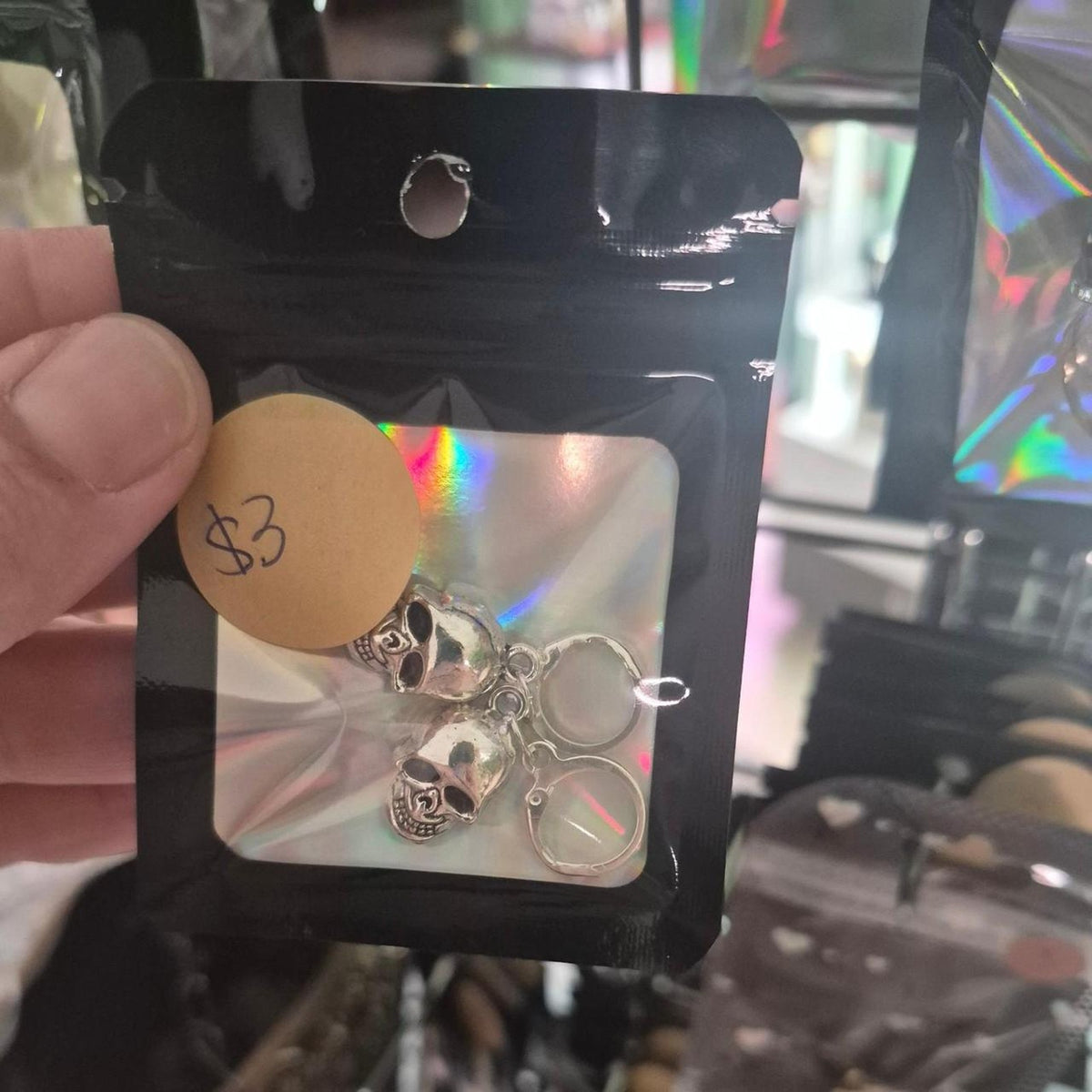 Silver skull keychain with handcuffs