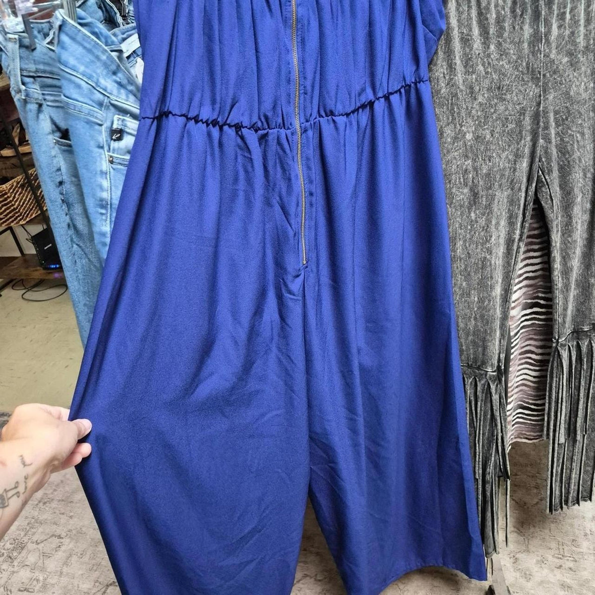 Blue jumpsuit with zipper detail