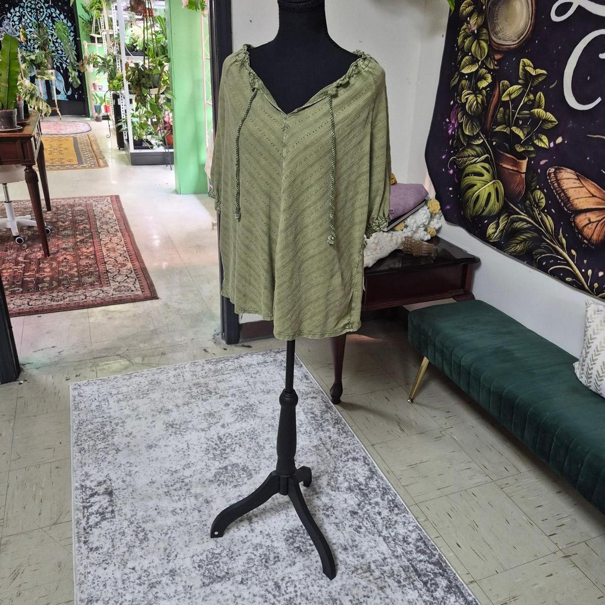 Green shirt with diagonal stripes
