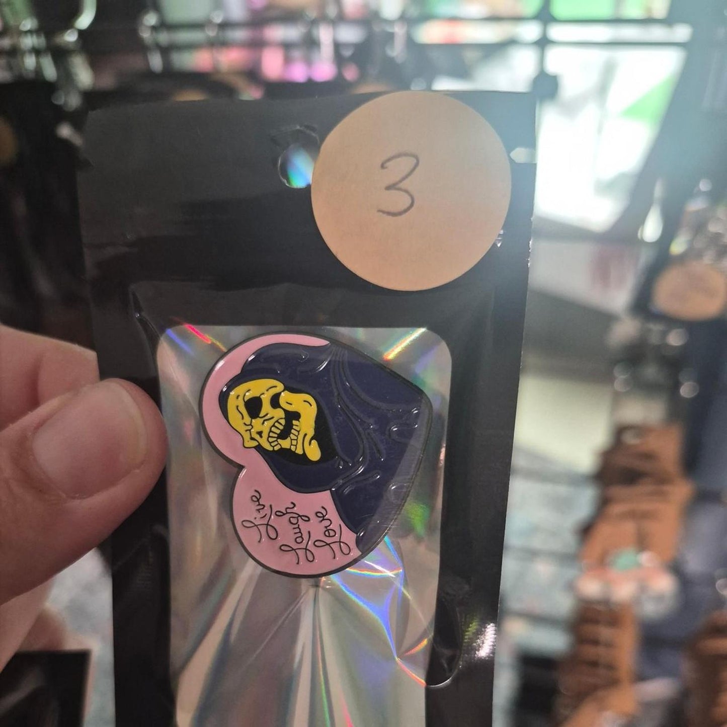 Yellow and black skull pin