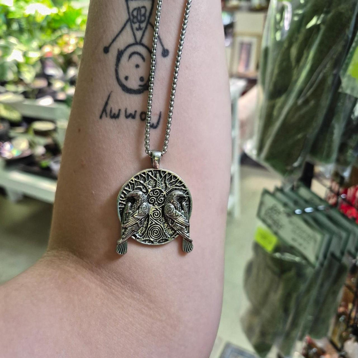 Silver pendant with two birds