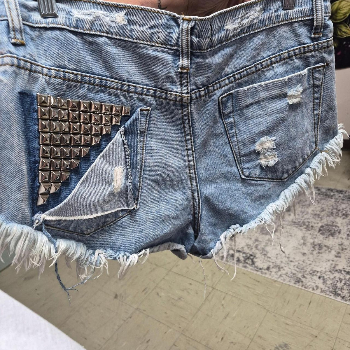 Blue denim shorts with frayed