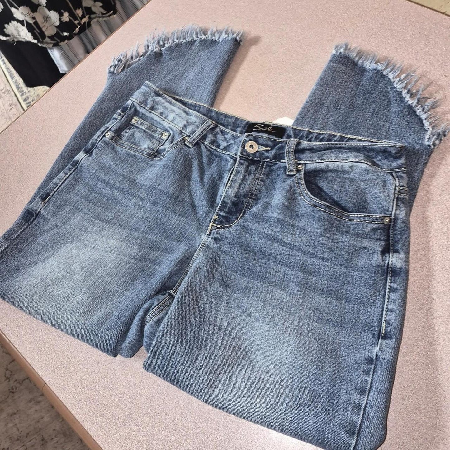 Blue denim jeans with frayed