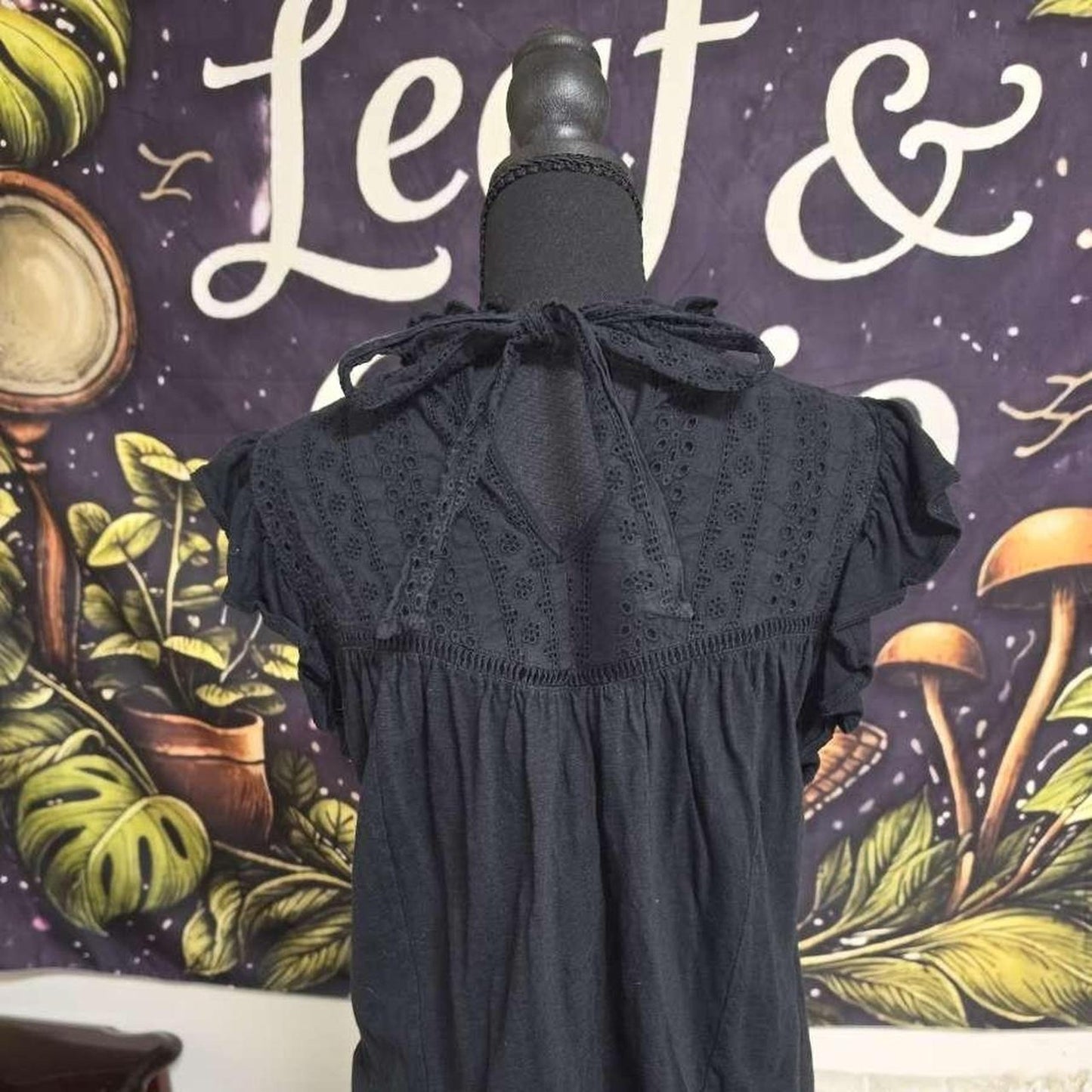 Black babydoll blouse with eyelet