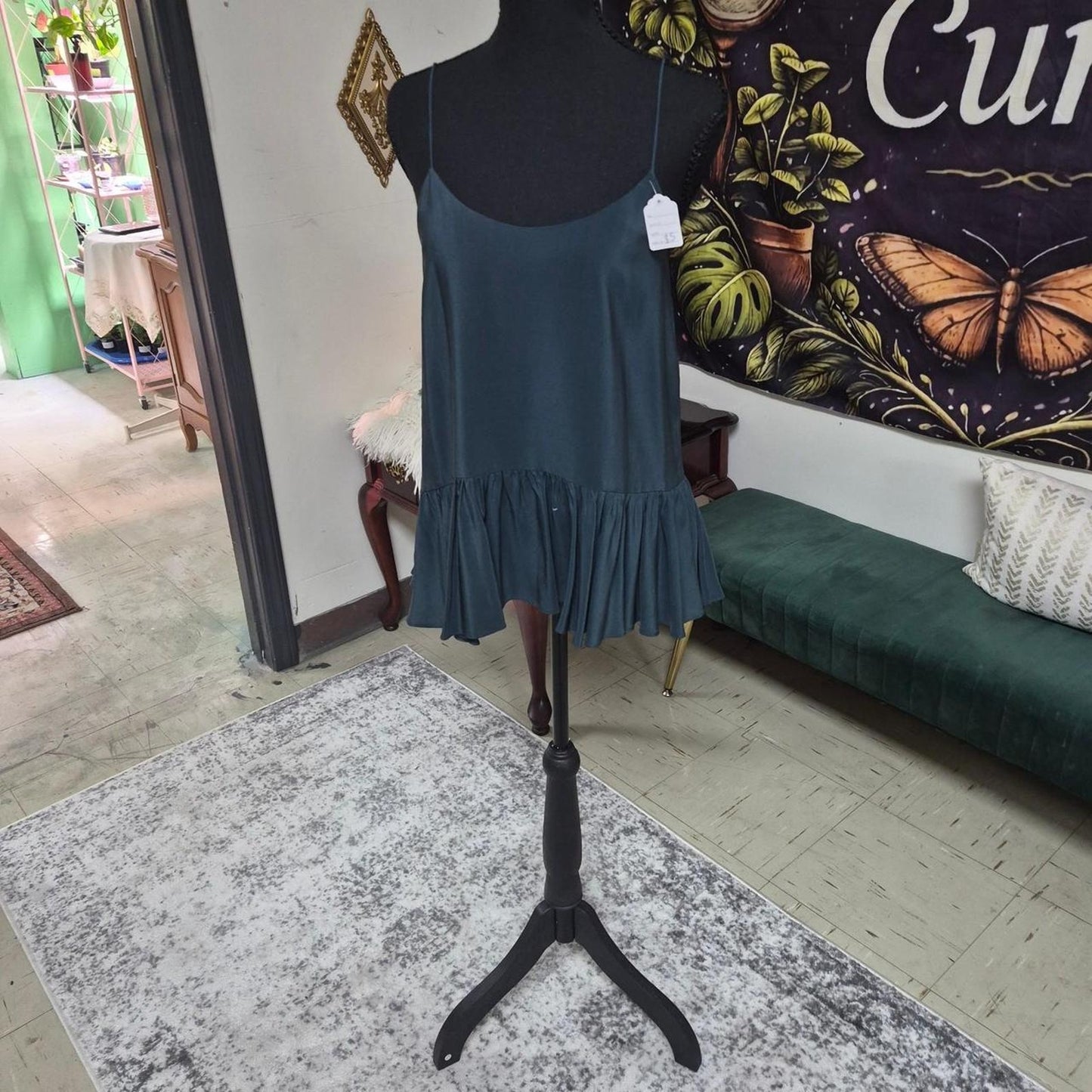 Teal shirt with ruffle hem