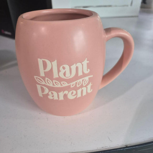 Pink mug with white text