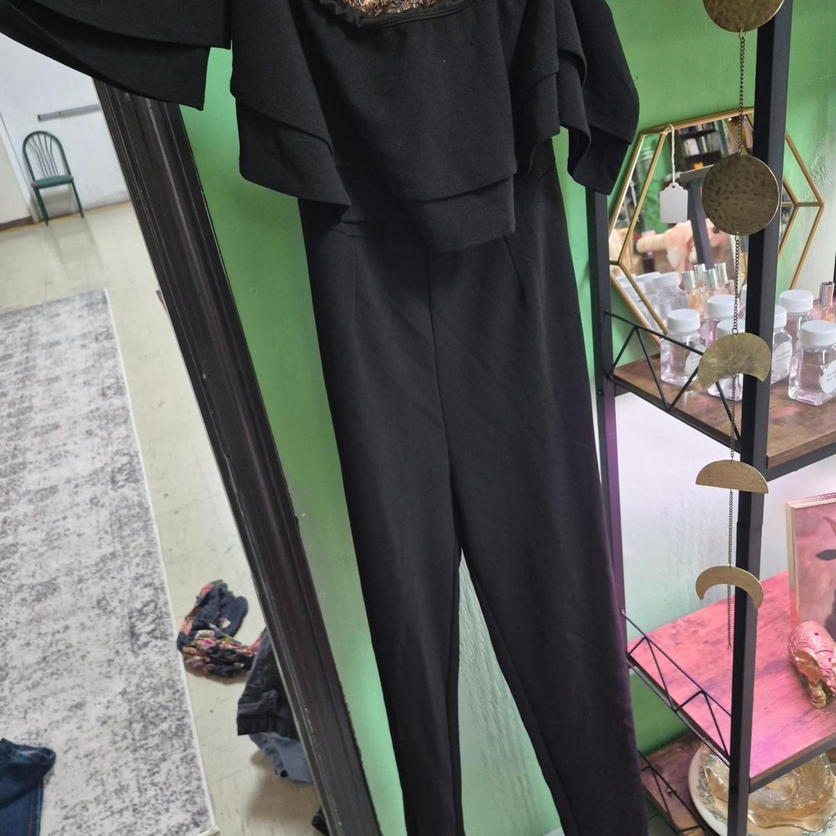 Black jumpsuit with ruffled sleeves