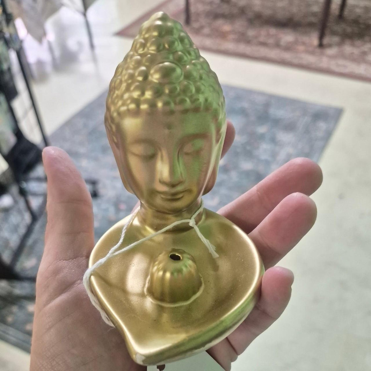 Gold buddha head incense holder