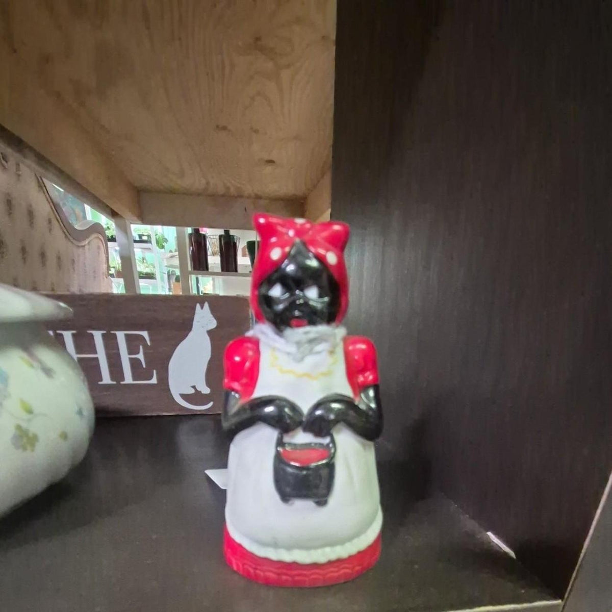 Red and black ceramic figurine