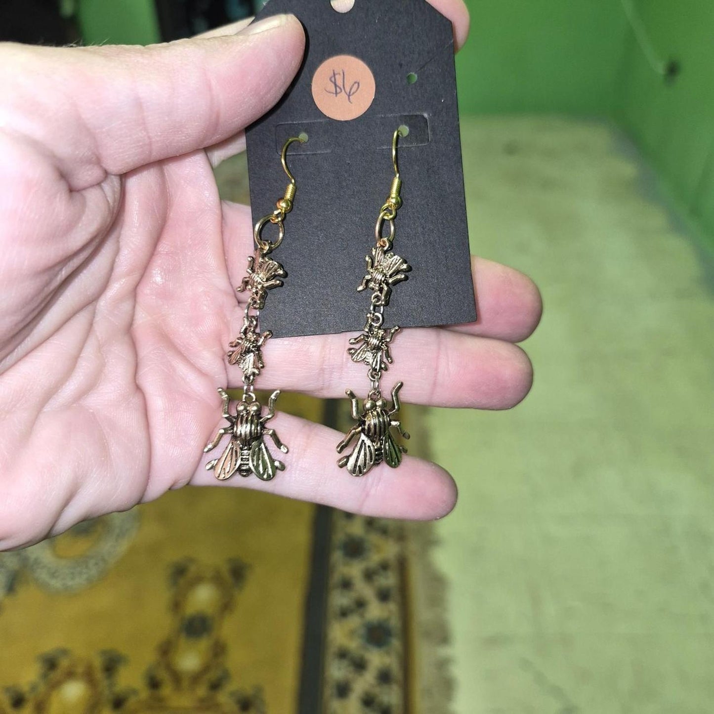 Gold bee earrings with three