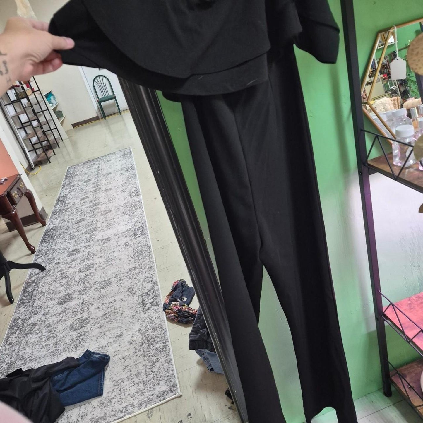 Black jumpsuit with ruffled sleeves