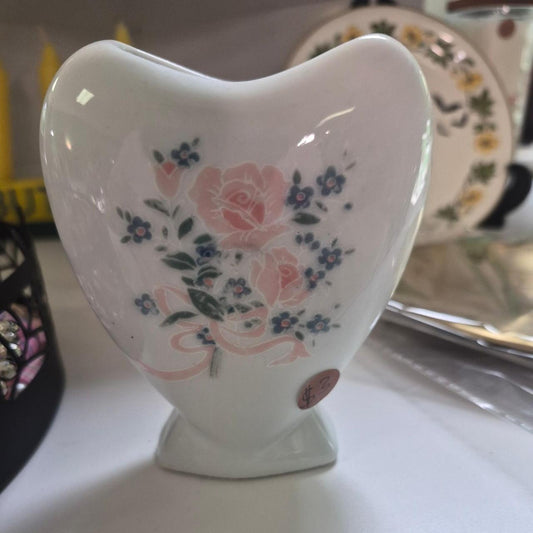 White ceramic heart shaped vase with