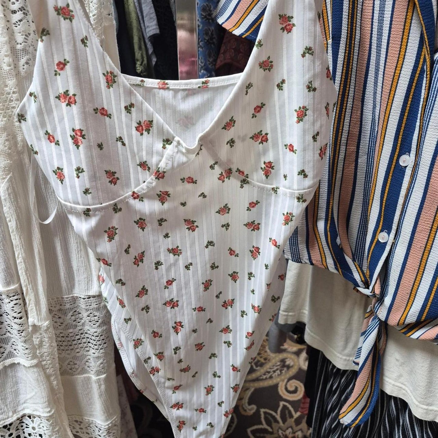 White bodysuit with small red