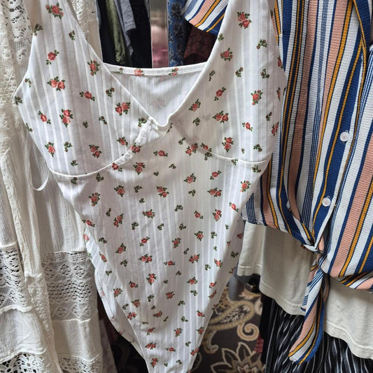 White bodysuit with small red