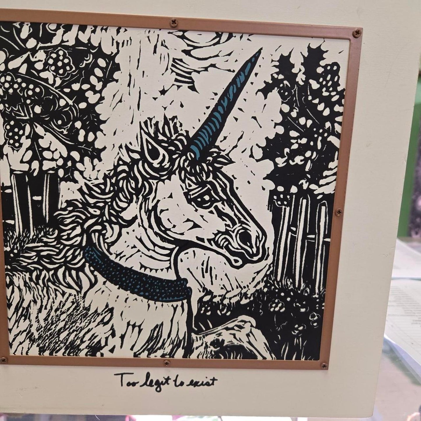 Wood picture witj unicorn says