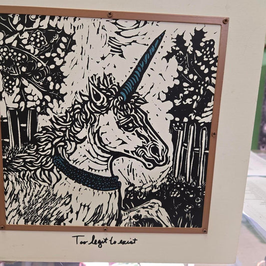 Wood picture witj unicorn says