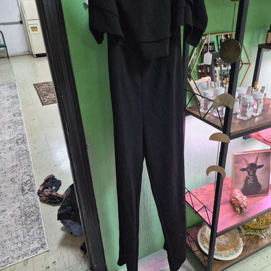 Black jumpsuit with ruffled sleeves