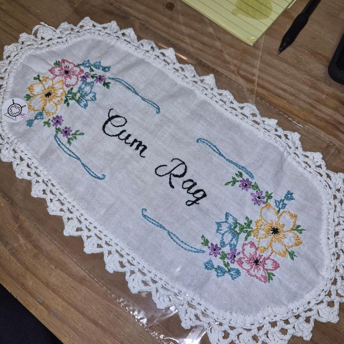 Cum rag embroidered floral design