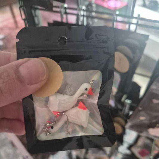 White duck earrings with orange