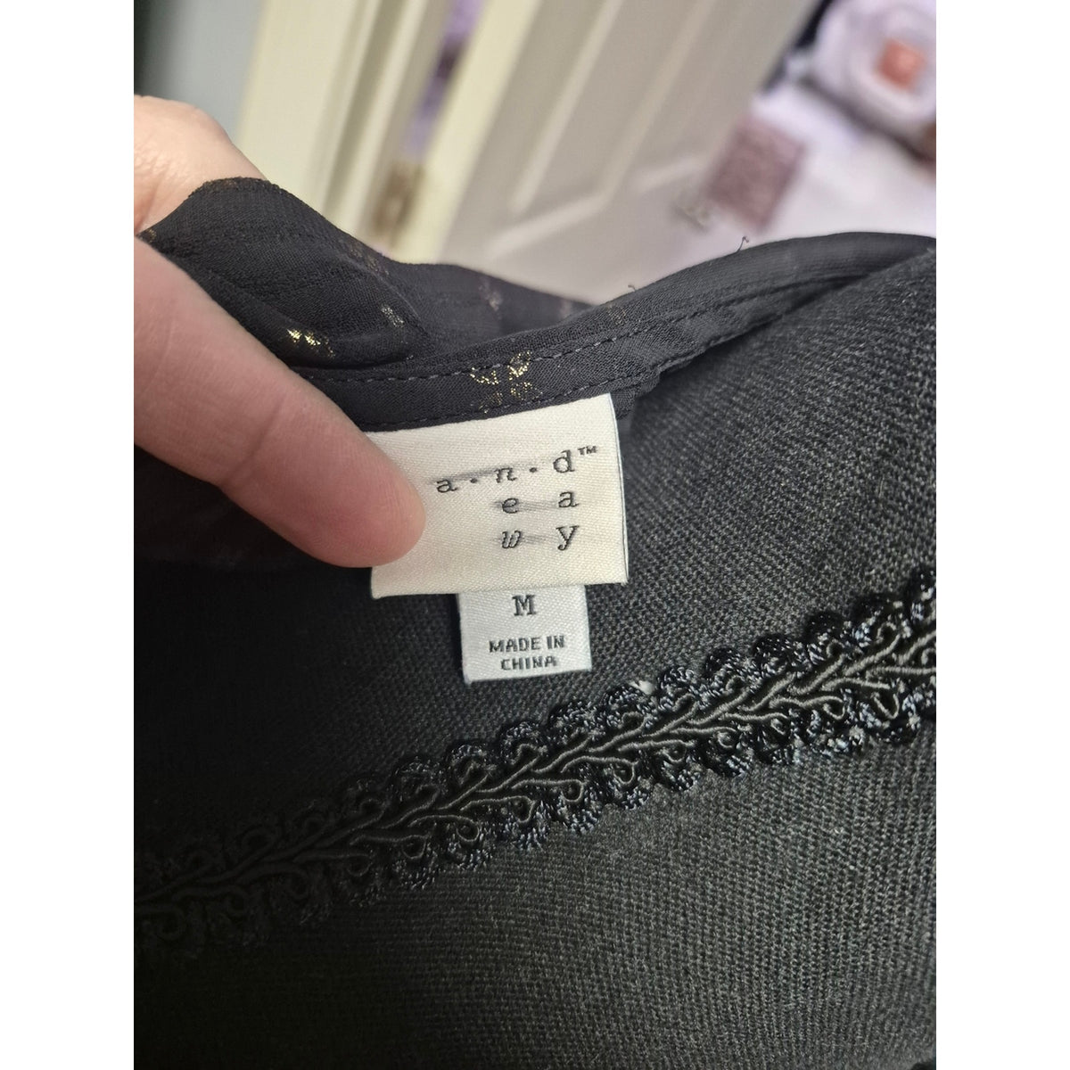 Sleeveless Black Sheer Shirt with Metallic Star Detail