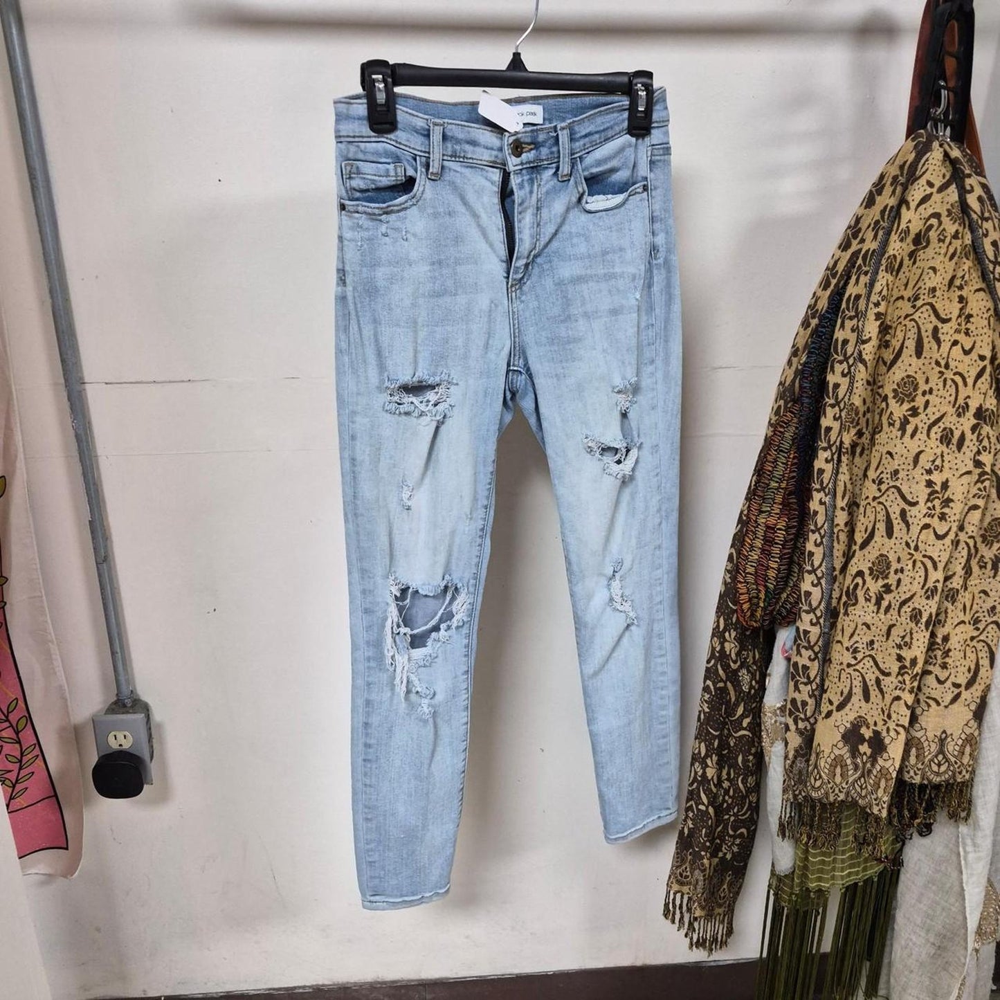 Light wash distressed skinny jeans