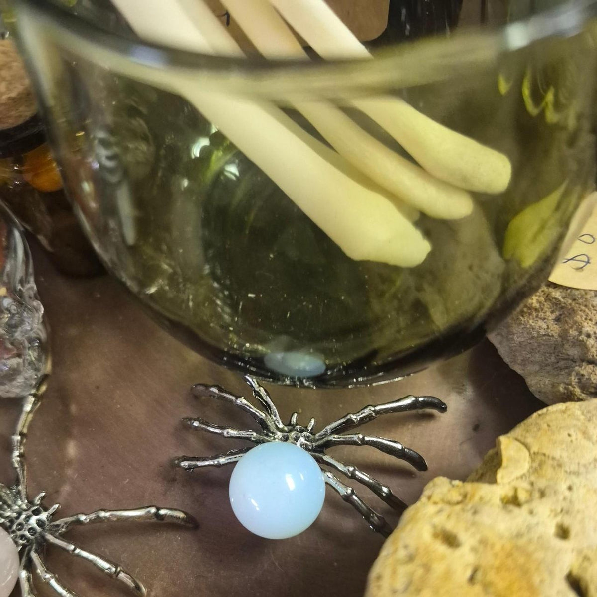 Silver spider charm with a