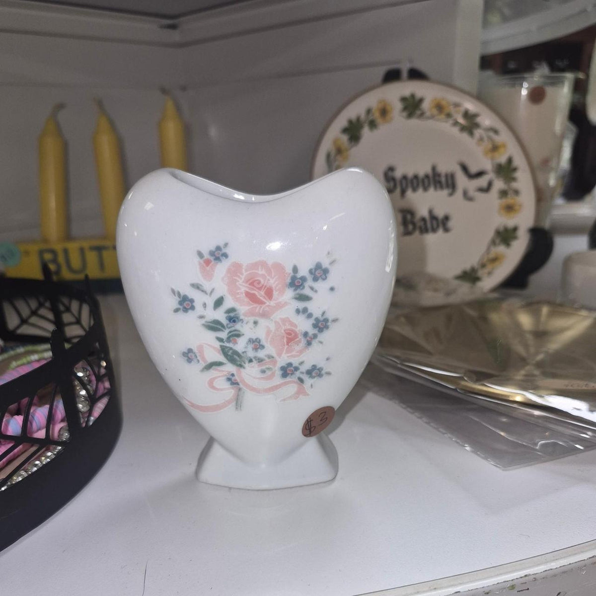White ceramic heart shaped vase with