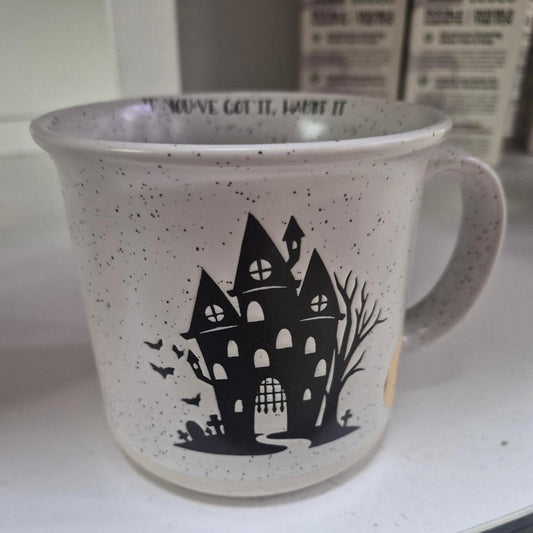 White speckled mug with black
