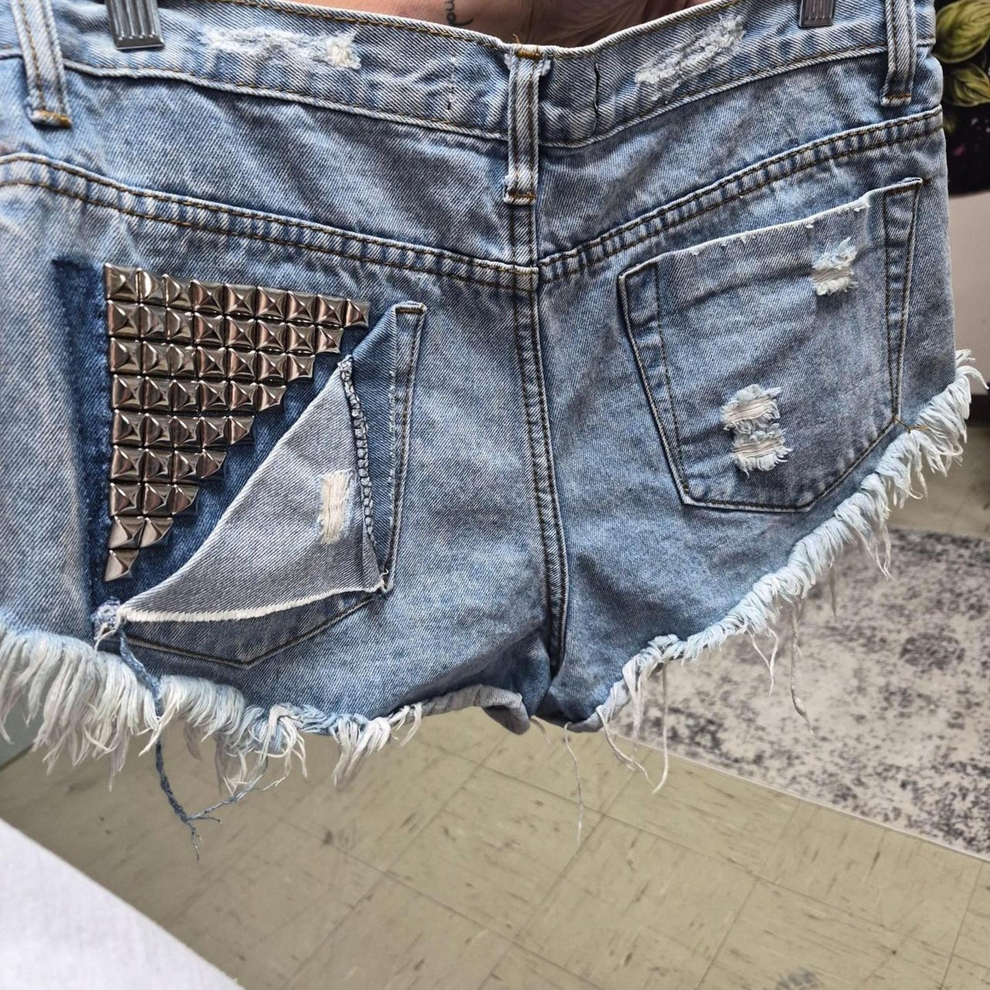Blue denim shorts with frayed