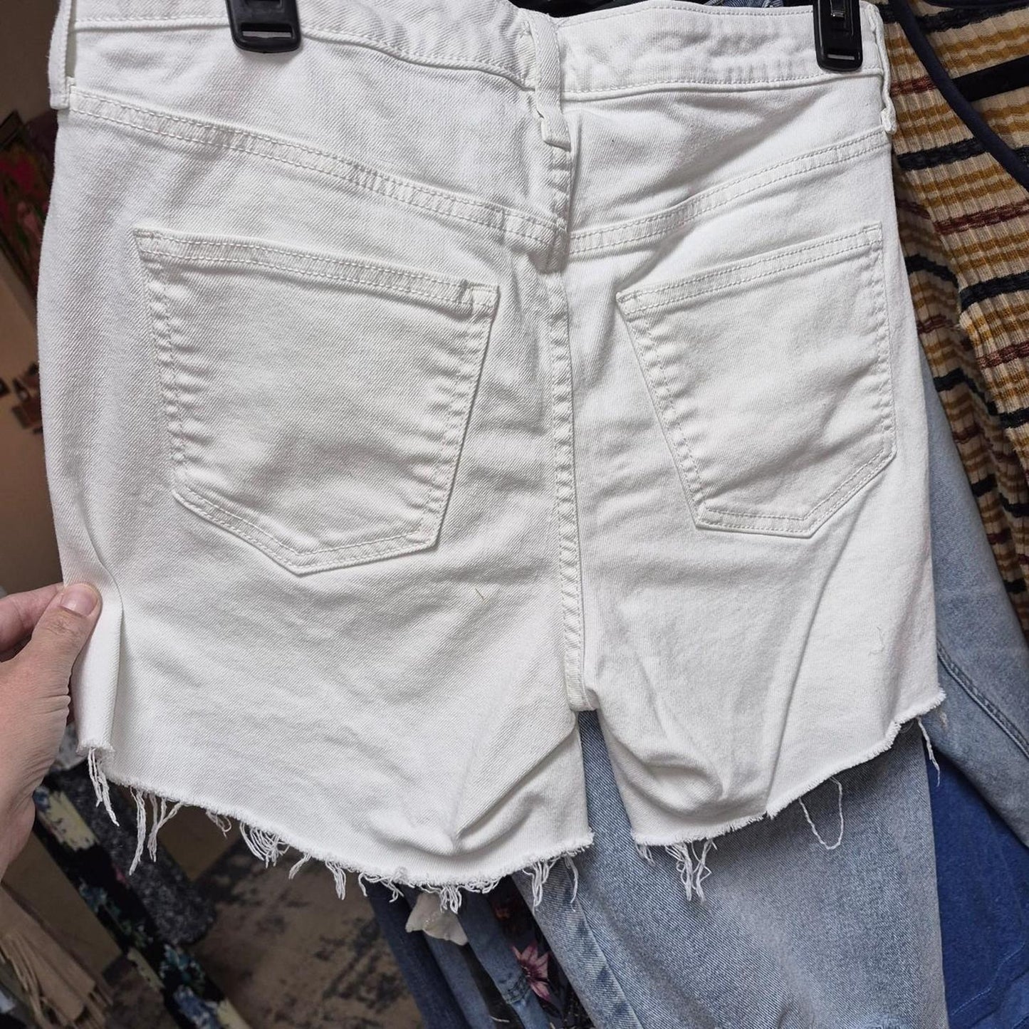 White denim shorts with frayed