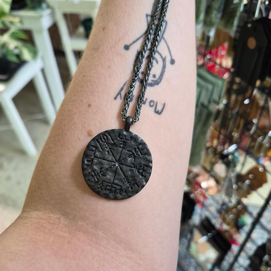 Black metal pendant with engraved
