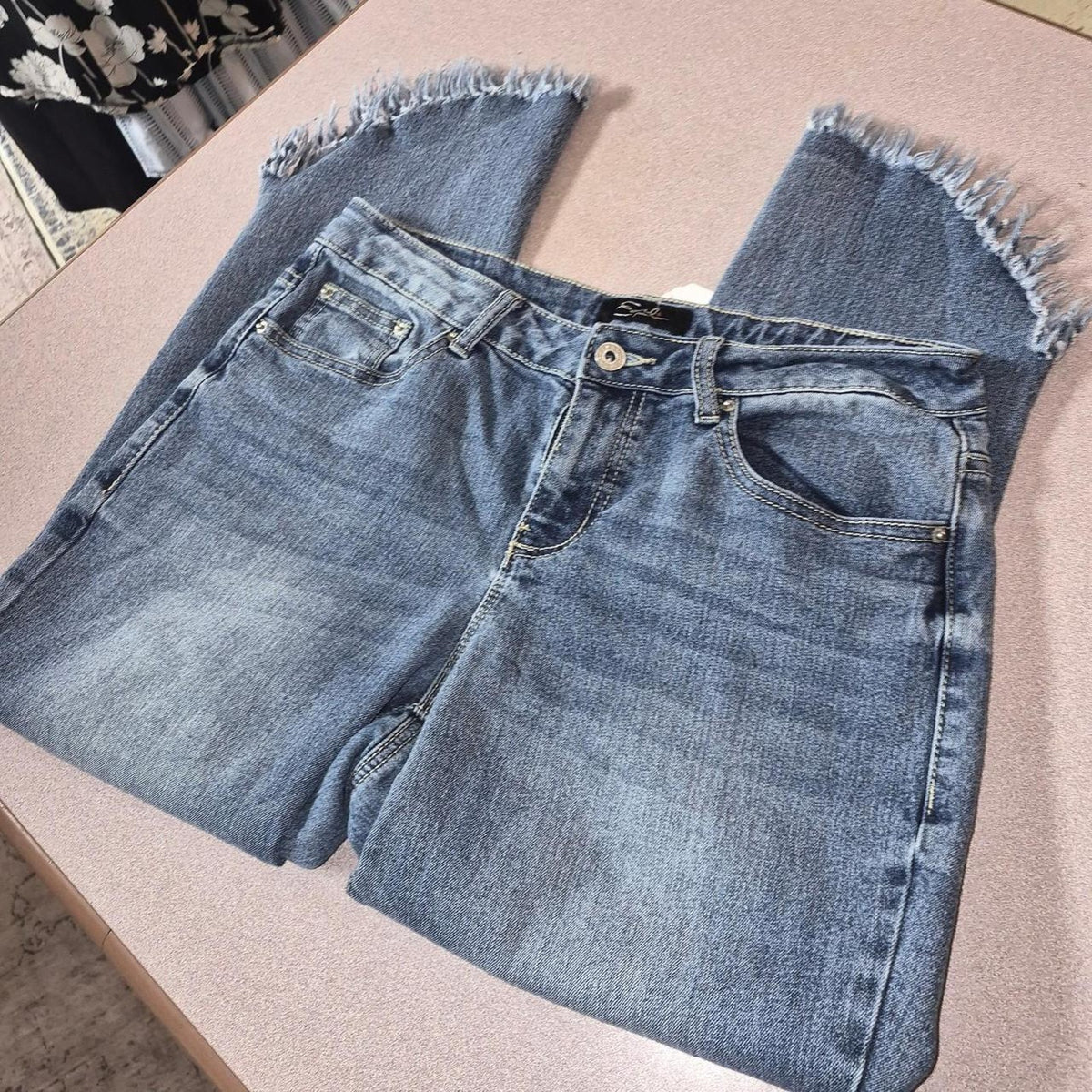 Blue denim jeans with frayed
