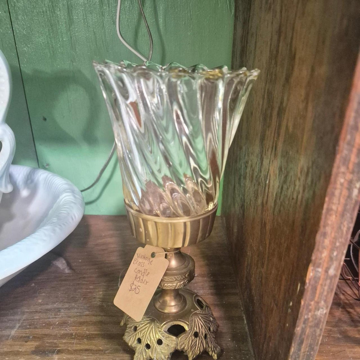 Glass candle holder with brass