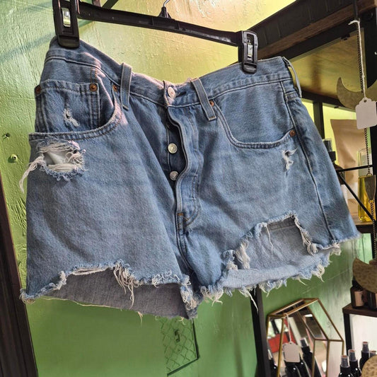 Blue denim shorts with distressed