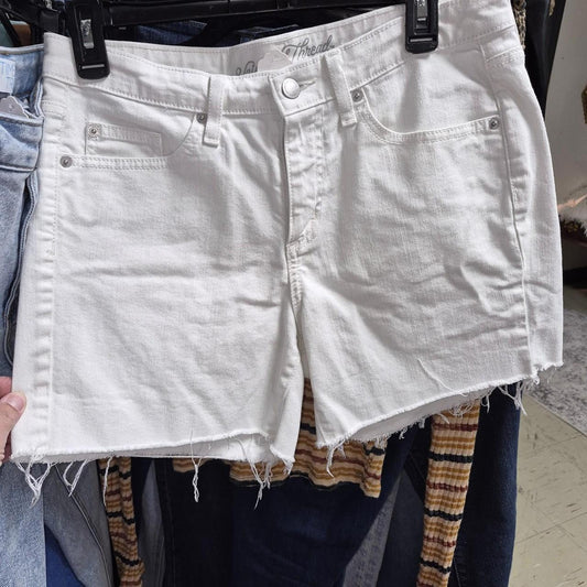 White denim shorts with frayed